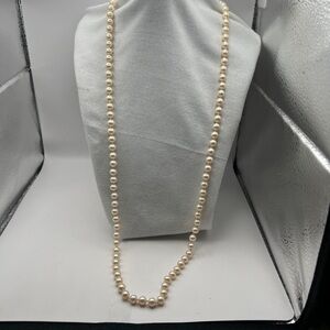Vintage Monet signed hand tied faux pearl necklace with gold tone clasp